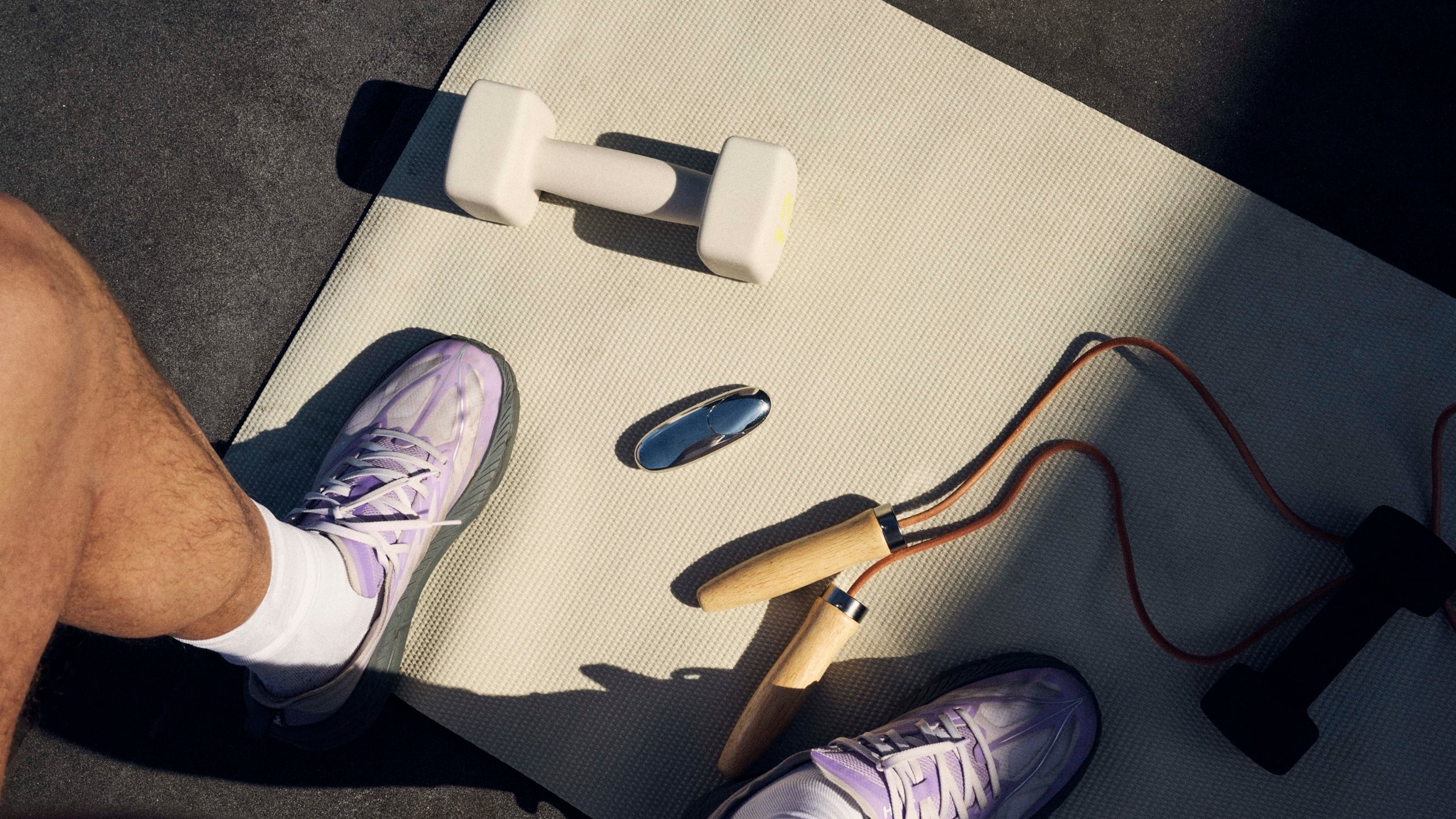 The halite atomizer beside gym kit on a mat